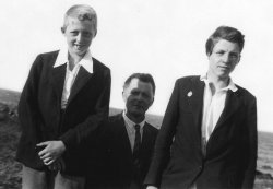 Black and white photo of a father and his two sons